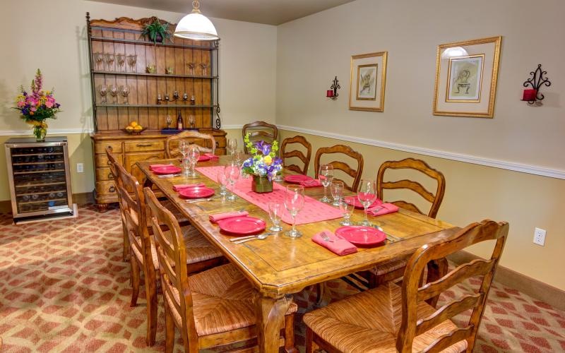 a dining table with plates and glasses on it