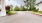 a street with trees and grass