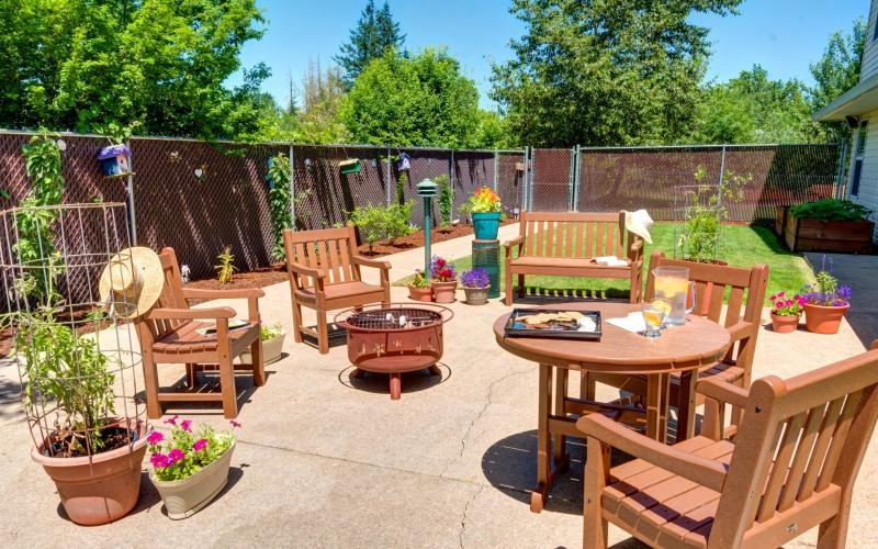 a patio with a table and chairs